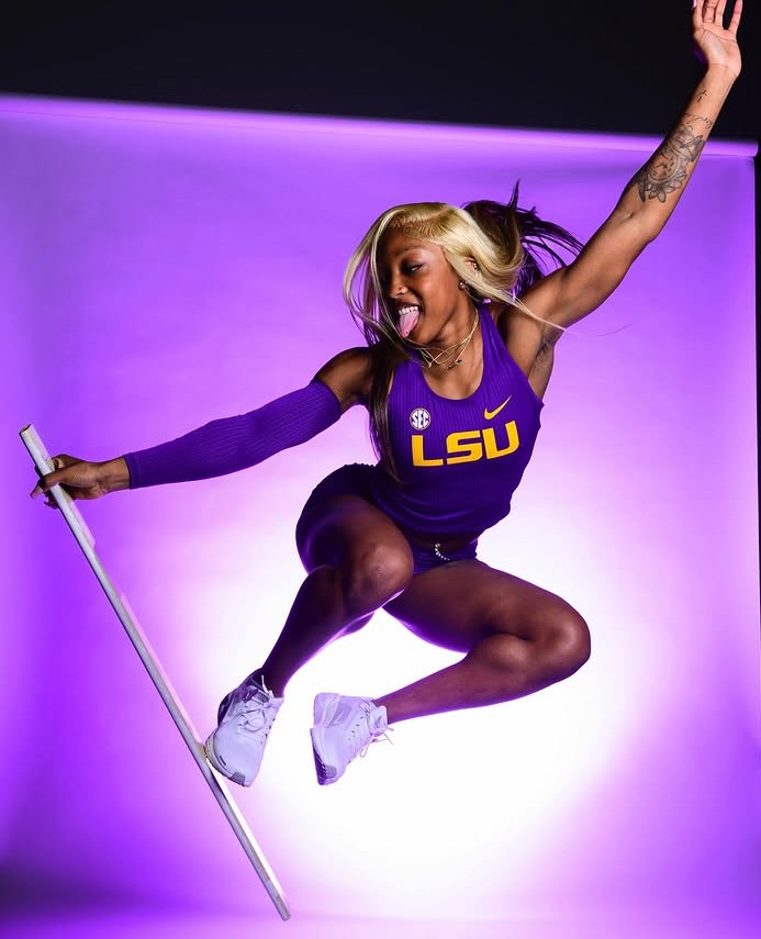 Makeriah Harris mid-jump in LSU purple and gold
